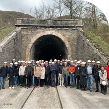 Participants of the ANCHORS Annual Meeting in front of a tunnel entrance.